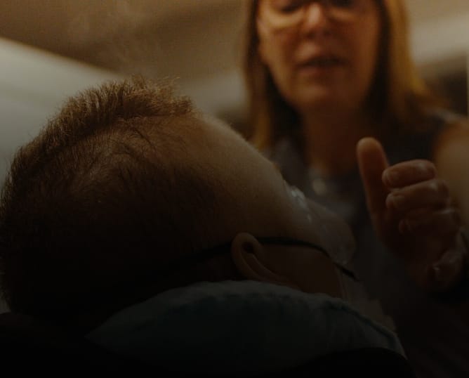 Mother caring for son with rare disease