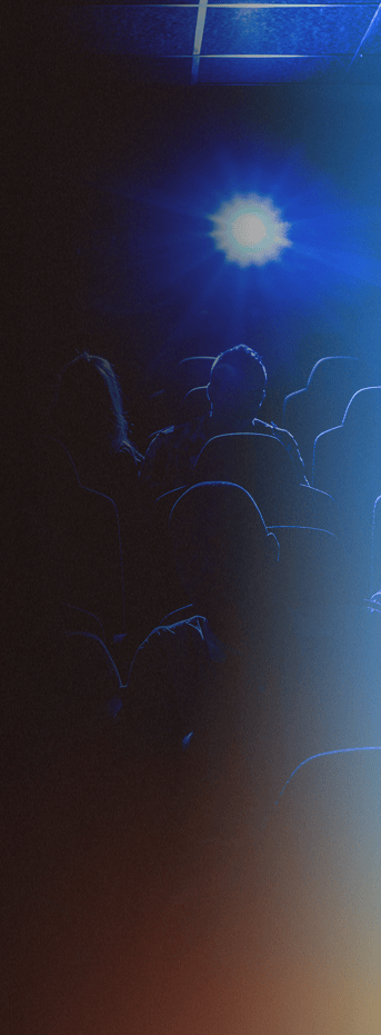 figures seated in movie theater